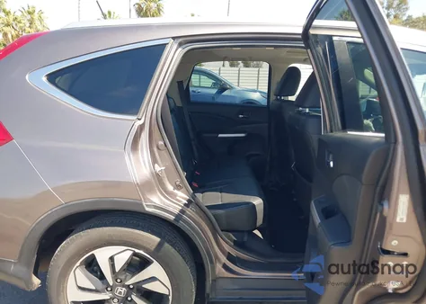 2015 Honda Cr-V Touring z USA, uszkodzony, nr VIN 5J6RM4H96FL133000